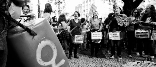 São Paulo, Brazil - May 28, 2016: Women play drums in action for the rights of gay women and the end of the coup d'etat in the country